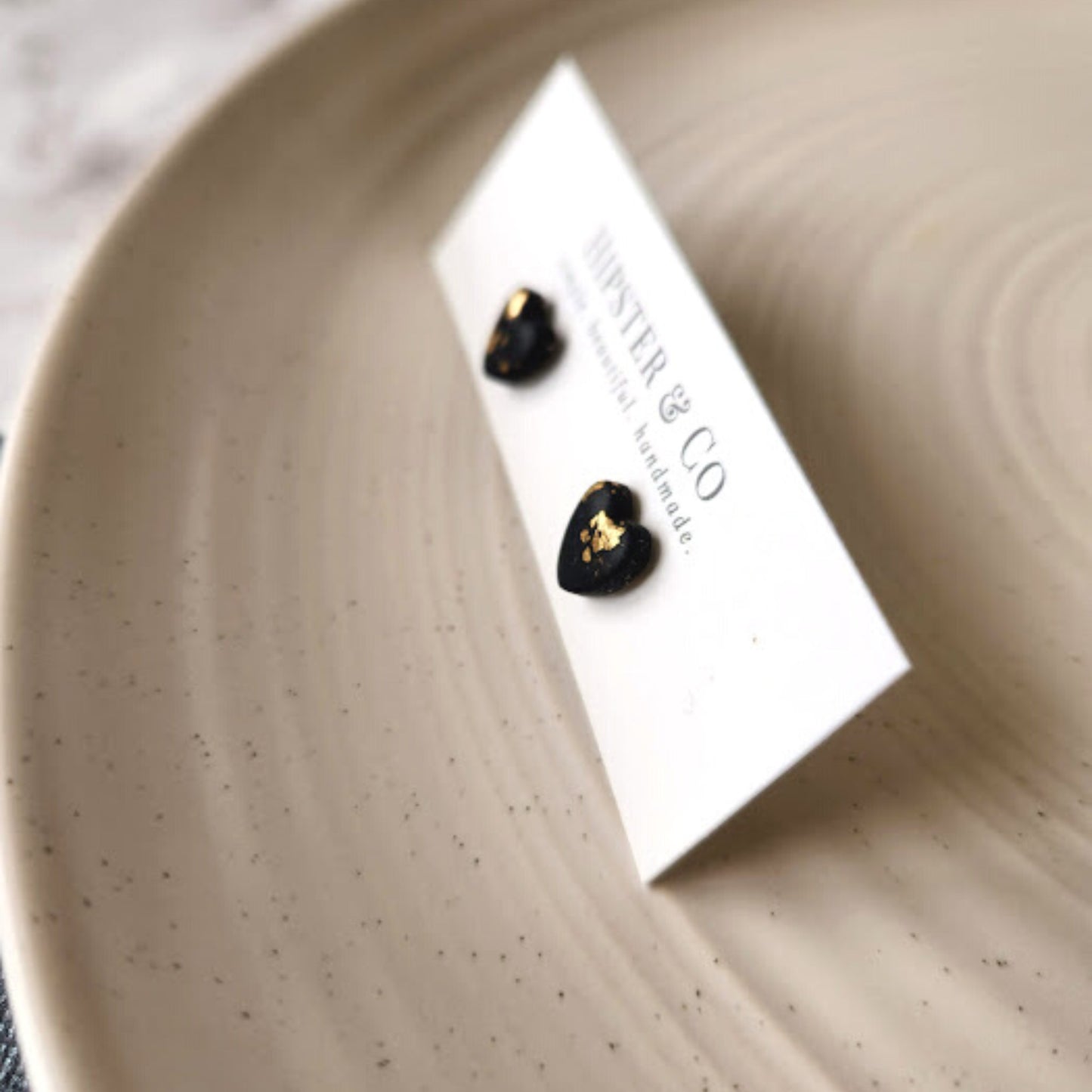 The Brielle Heart Shaped Black and Gold Polymer Clay Stud Earrings