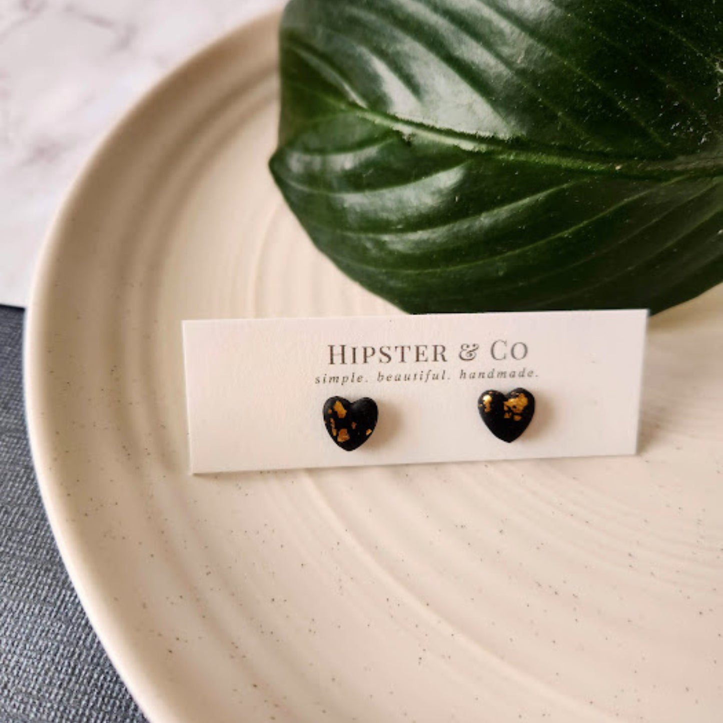 The Brielle Heart Shaped Black and Gold Polymer Clay Stud Earrings
