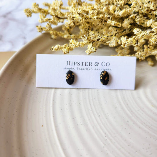 The Enza Black and Gold Oval Polymer Clay Stud Earrings